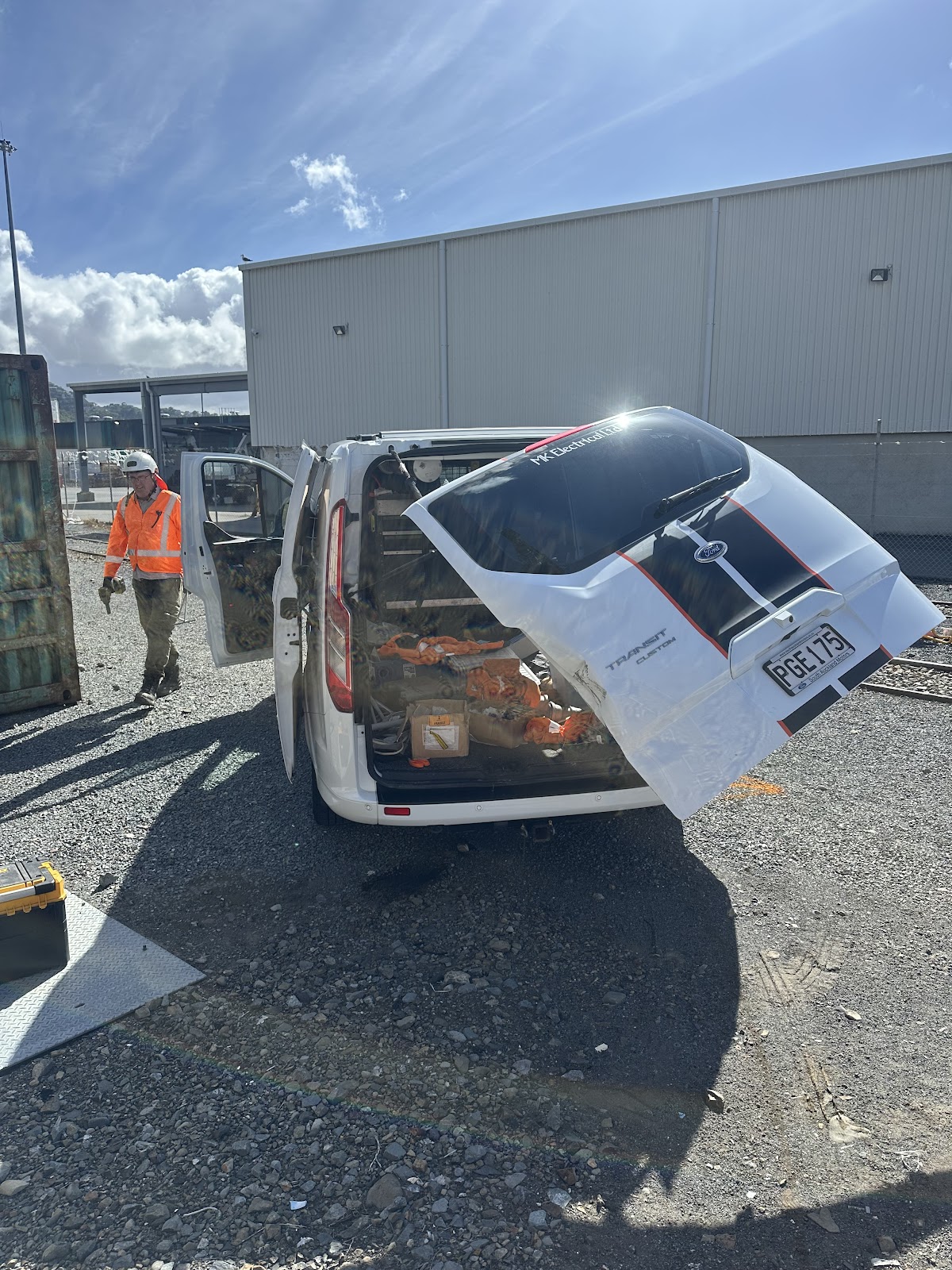 A technician assessing accident damage at Hutt City Panel and Paint